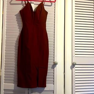 Revamped Premium Collection burgundy mid length side slit dress. Size medium.
